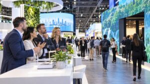 Trade show team working on the future of trade show advertising: trends every exhibitor should watch in a convention booth setting